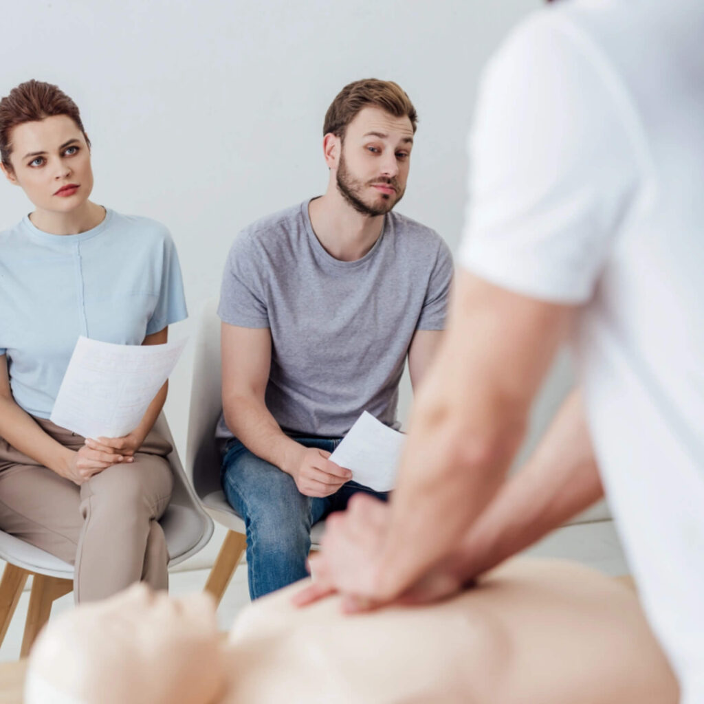 Instructor led first aid training class on cpr and emergency respons